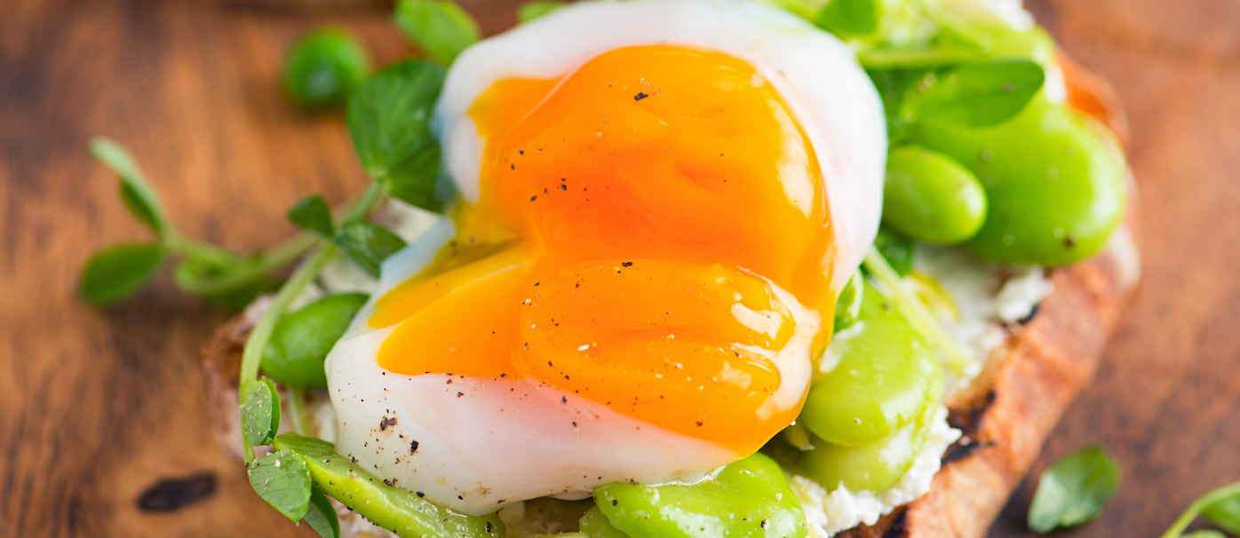 Bruschetta,With,Cream,Cheese,,Fava,Beans,,Pea,Sprout,And,Poached